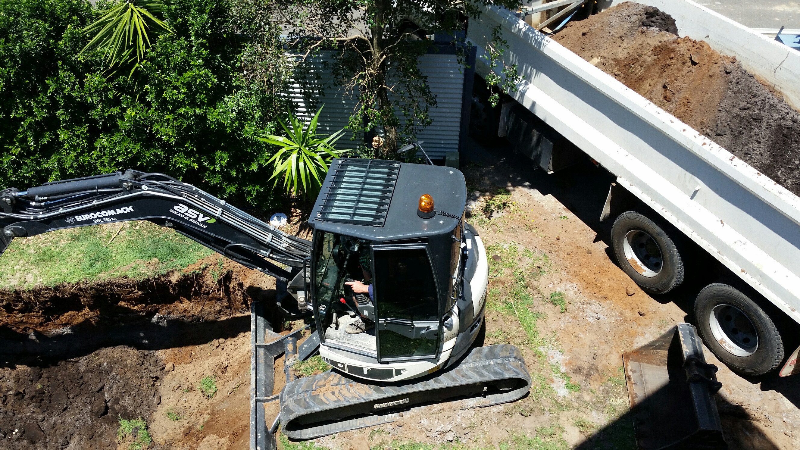 Excavator digging pool
