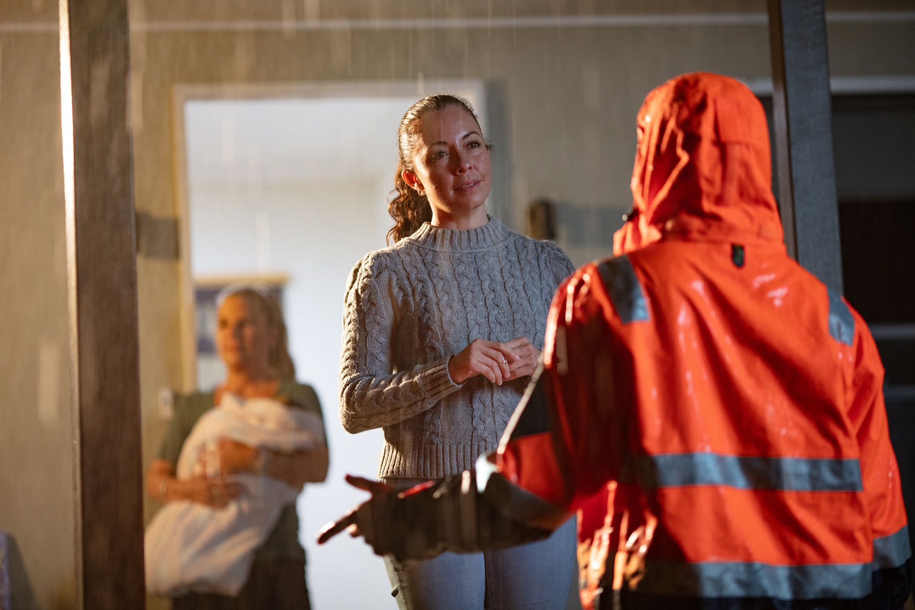 Unitywater crew talking to customer during wet weather
